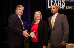 Lt. Kimberly Owens and Cornell Perry accept the 2014 Best of Texas Award on behalf of the Dallas Police Department